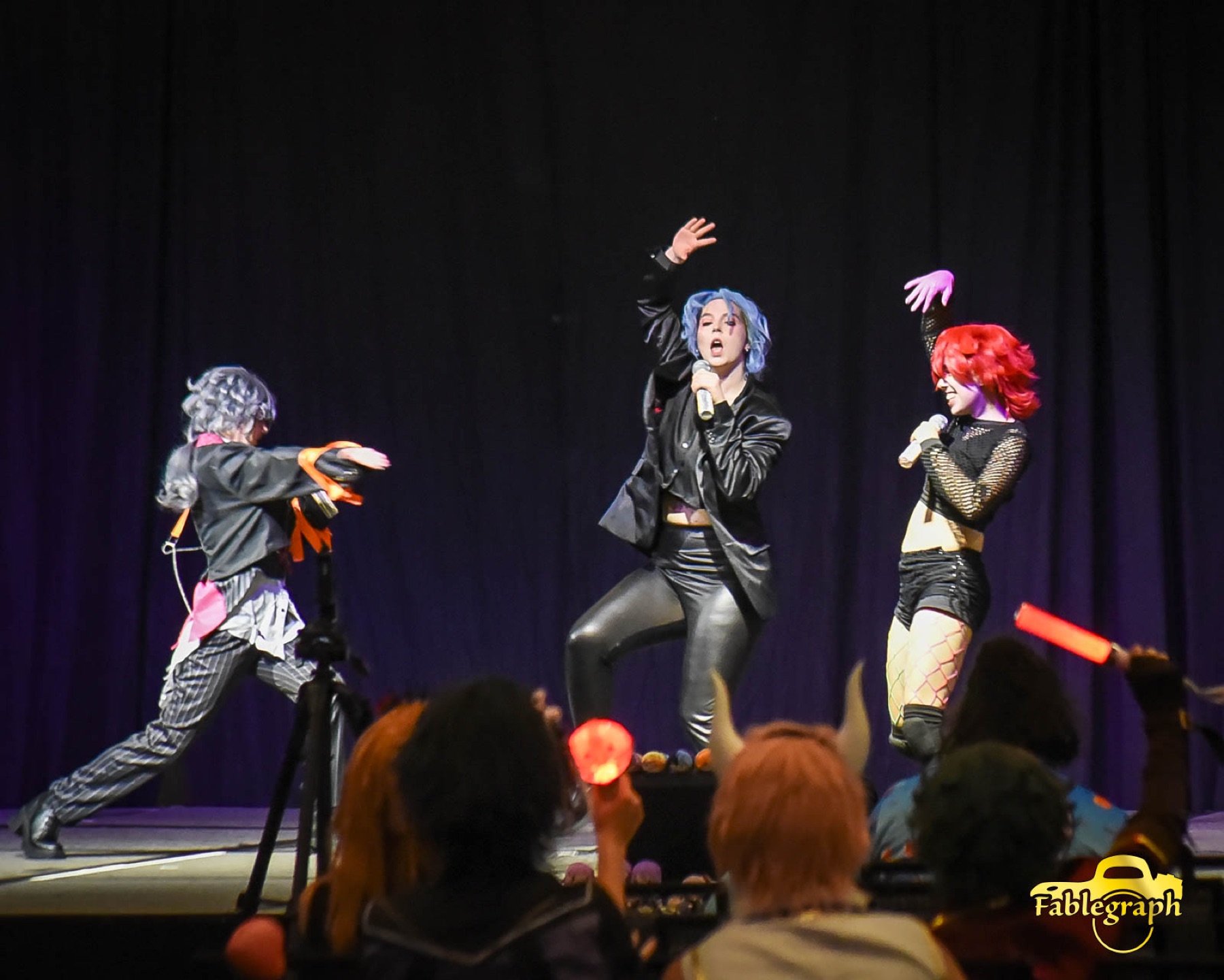 Performers on stage at Queen City Anime Con