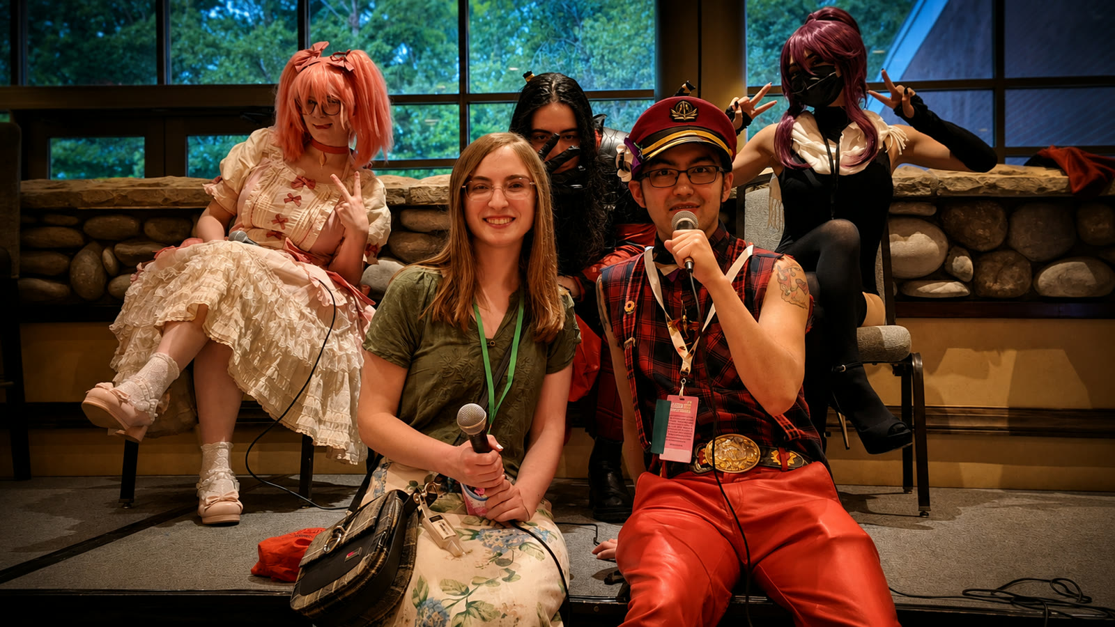 Cosplayers and attendees with microphones in the QCAC Lounge