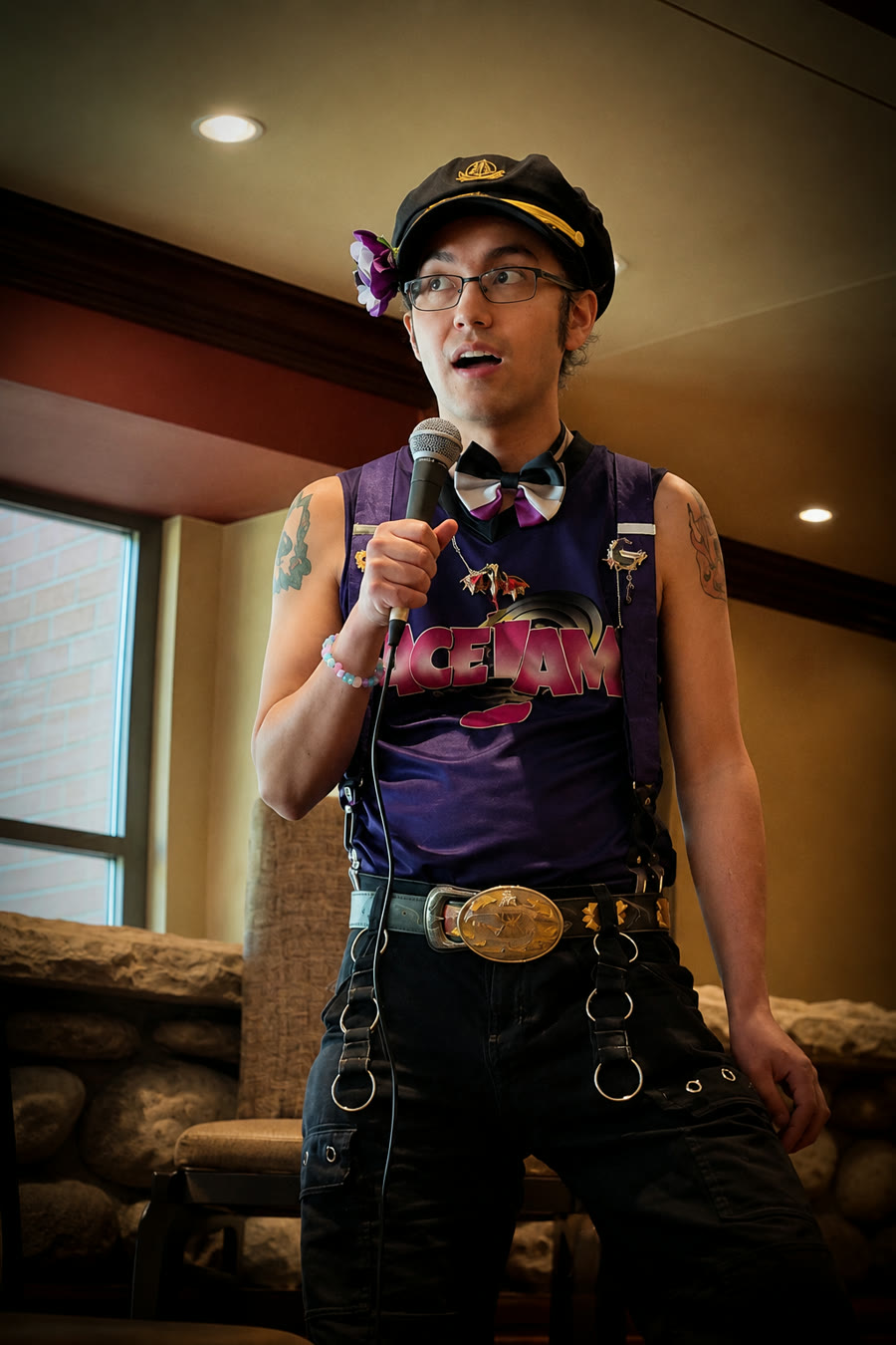 QCAC Lounge host holding a microphone