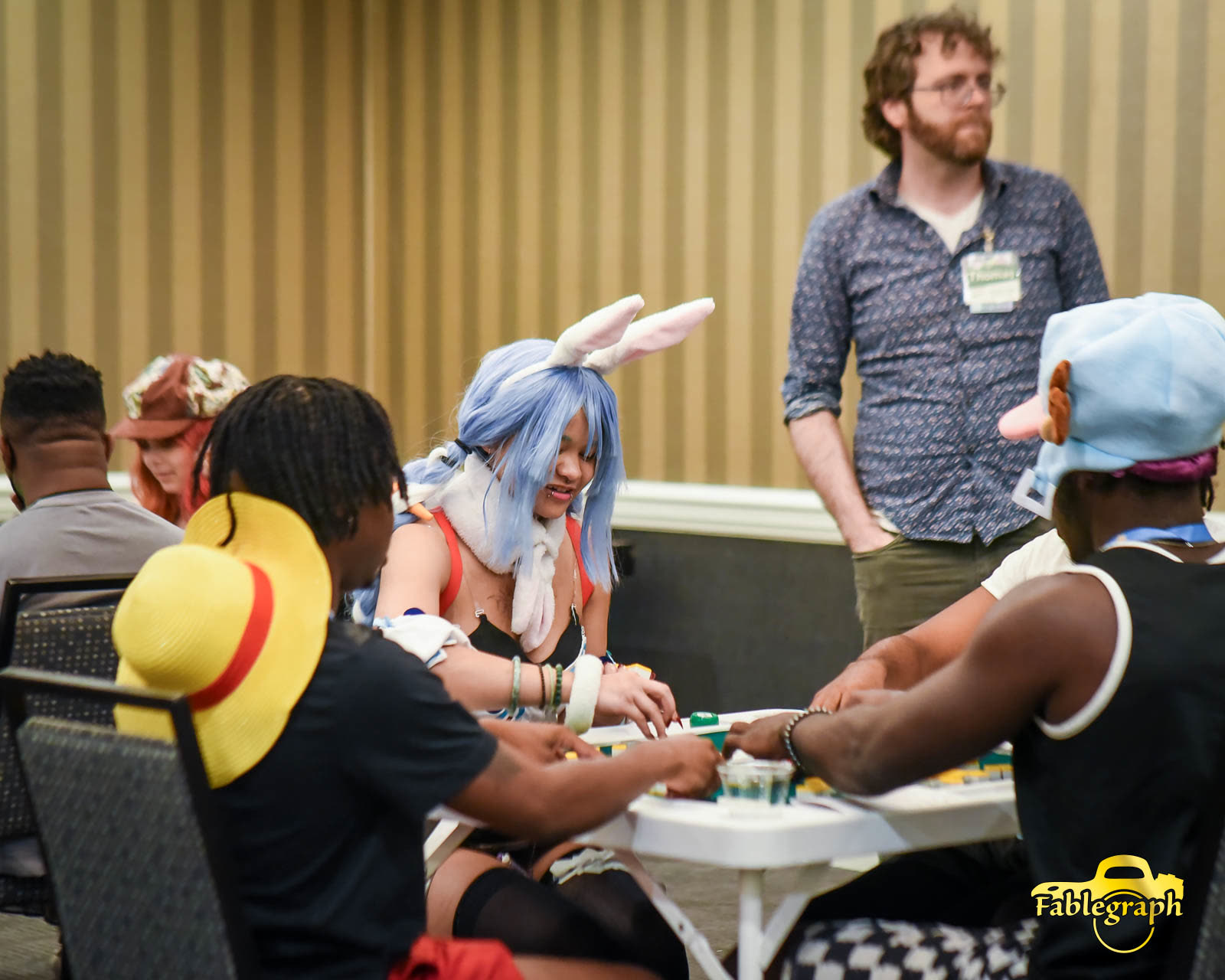 Attendees playing tabletop games at Queen City Anime Con