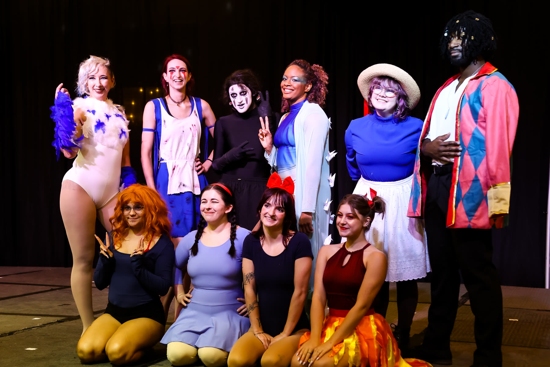 Masquerade contestants on stage at Queen City Anime Con
